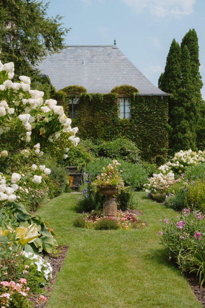Romantic garden ceremony space at Greencrest Manor wedding venue in Battle Creek Michigan. Wedding photographer