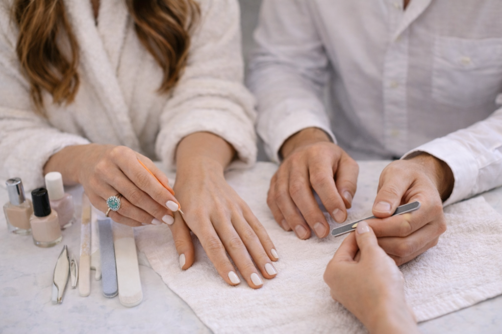 Couple getting manicure and cleaned hands before engagement photo shoot. What outfit for engagement photos