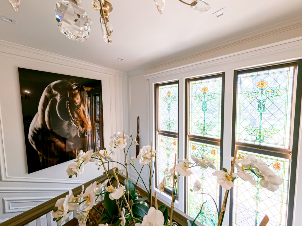 Hidden garden ceremony space at The Inn at Stonecliffe Mackinac Island wedding venue with wooden chairs and lush greenery. Wedding photographer