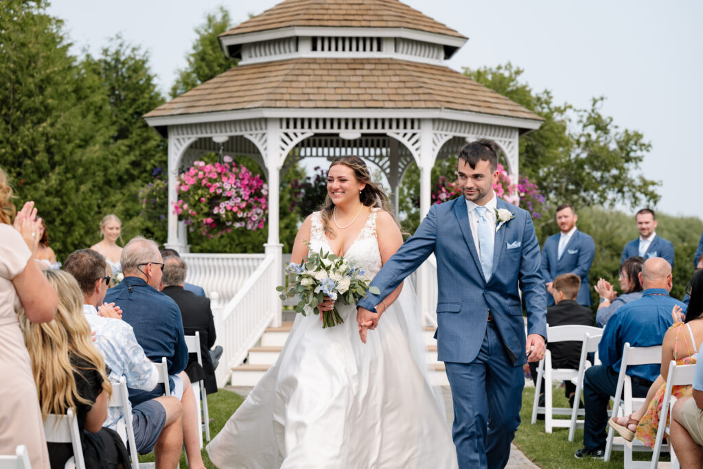 Mission point mackinac island wedding couple leaving their ceremony