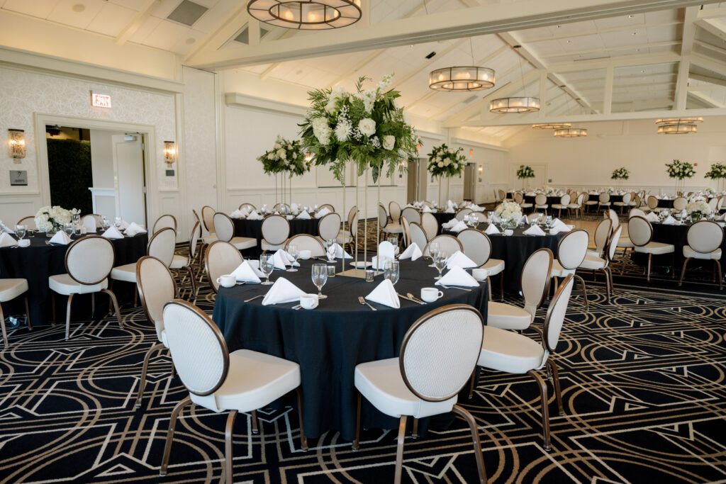 Wedding reception table decor with florals. Black and white decor. Midland Michigan country club.